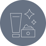 Icono de productos para el cuidado de la piel junto a estrellas brillantes que representan la «piel sana».